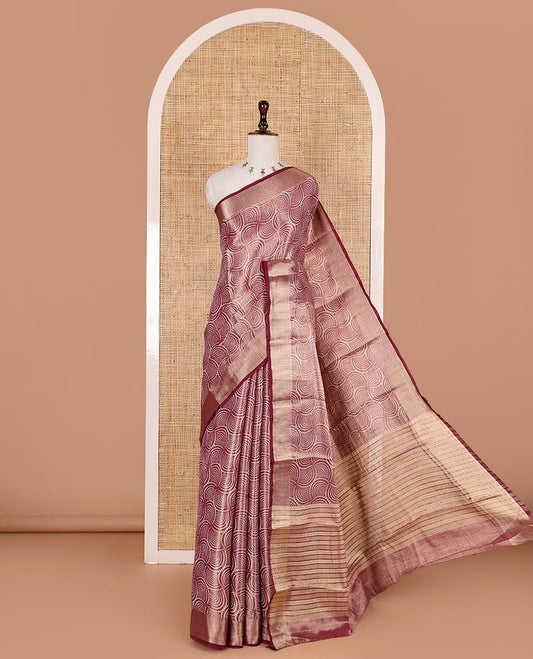 Wine scallop design tissue saree, zari striped border, striped pallu, and gleaming matching blouse
