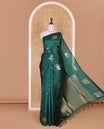 Borderless green floral and elephant buttas zari woven kanchi silk saree, intricate pallu, and matching zari design blouse