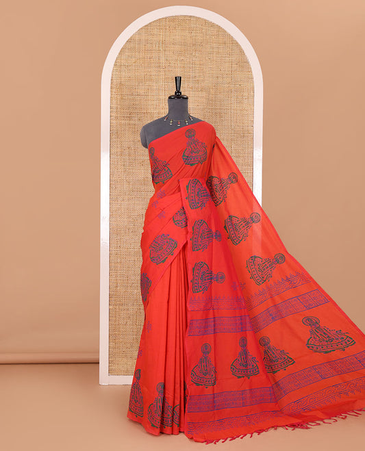 Borderless orange kolam and kathakali motifs printed South cotton saree with a matching blouse, and a contrast floral vine printed blouse