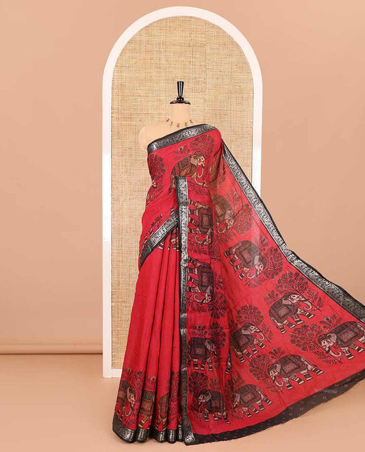Red plain muslin cotton saree, contrast wedding-theme of floral and elephant motifs print, printed pallu, and a contrast buttas and zari bordered blouse