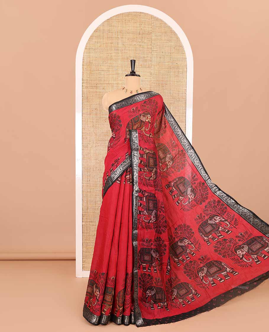 Red plain muslin cotton saree, contrast wedding-theme of floral and elephant motifs print, printed pallu, and a contrast buttas and zari bordered blouse