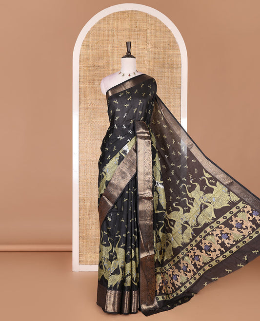 Black-green dargon fly and cranes motifs printed dola silk saree, contrast gold zari border, Mughal floral printed pallu, and dragon fly printed blouse