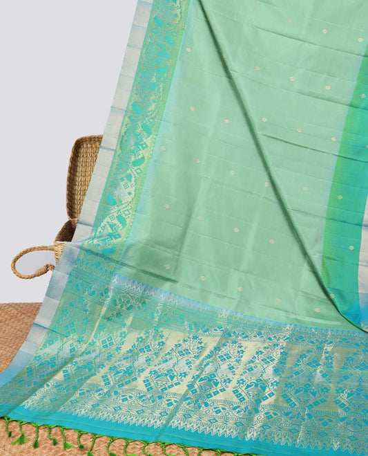 Green floral buttas soft silk saee with contrast ikkat zari border & floral zari design pallu