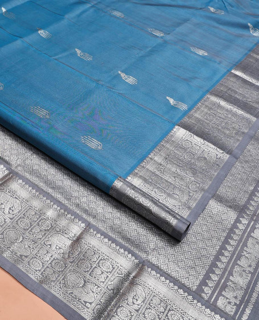 Blue Venkatagiri Silk Saree, Woven with Zari Buttas All Over Its Body, Complemented by a Contrast Traditional Zari Border of Peacock, Elephant, and Chakram Designs, Jaal Design Pallu, and Paired with a Contrast Blouse
