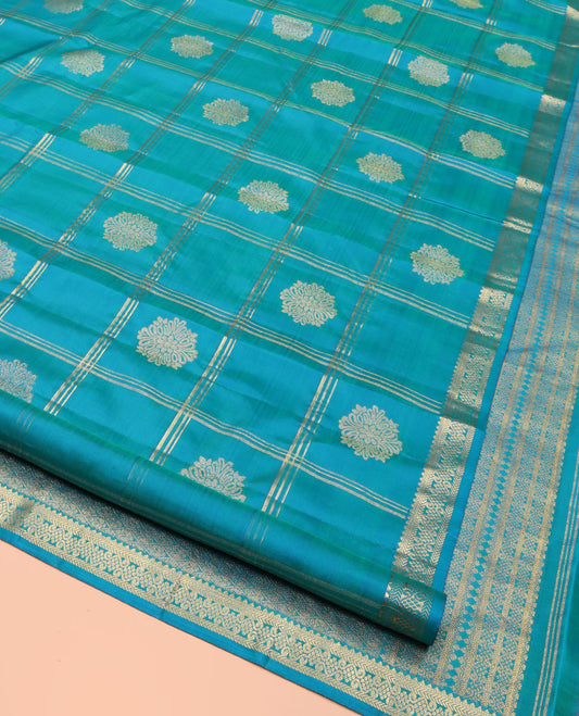 Blue Kanchipuram Silk Saree, Enriched with Zari Butta Enclosed Checked Design All Over Its Body, Subtly Zari-Woven Border, Grand Jaal Design Pallu, and Paired with a Matching Blouse
