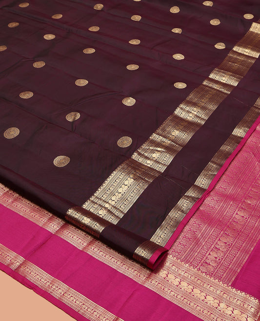Maroon Vasundhara Silk Saree, Spotlighted with Chakram Buttas, a Rettai Pettu Border of Muthu, Kodi Visiry, and Mayil Designs, Contrast Grand Pallu, and a Contrast Blouse