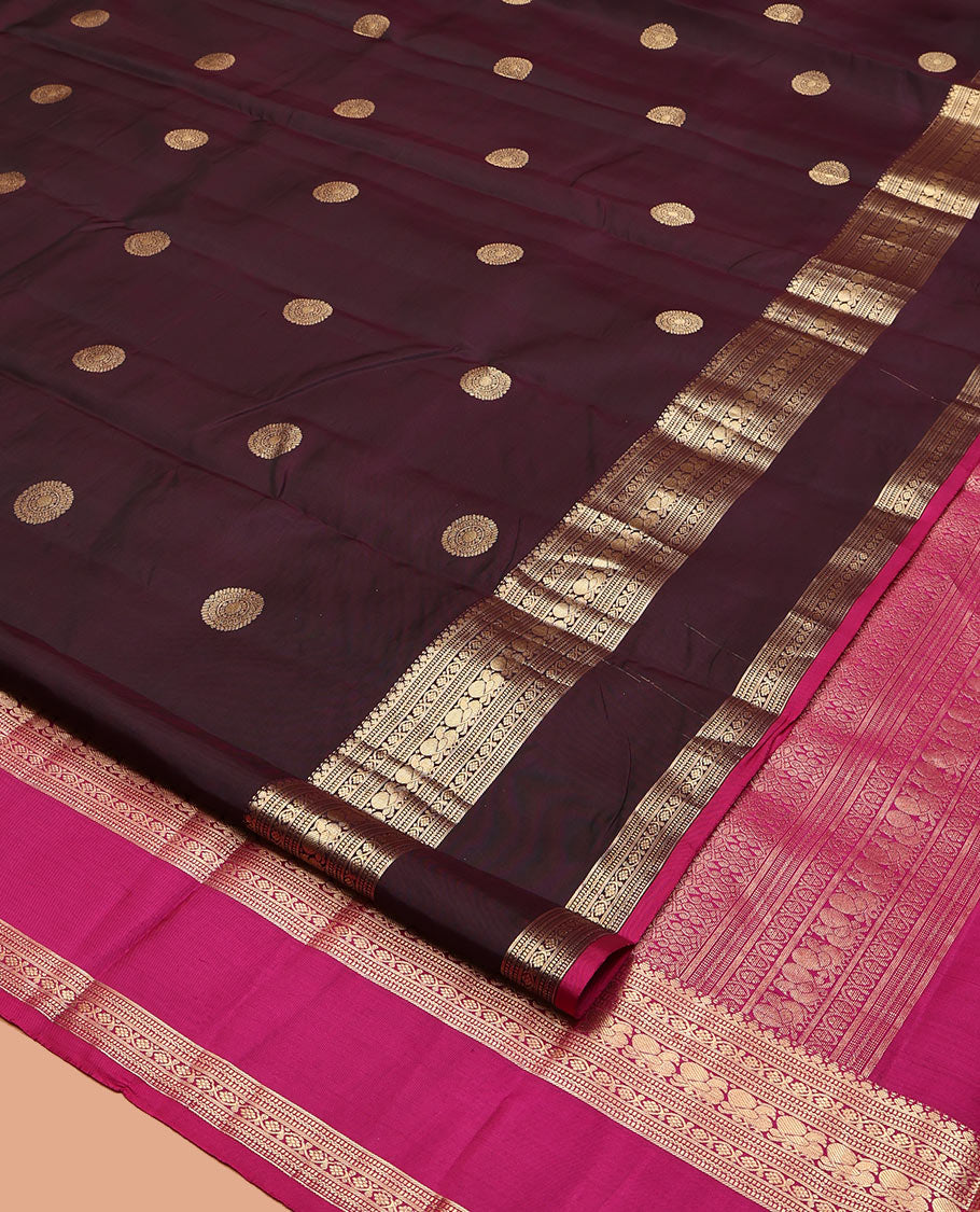 Maroon Vasundhara Silk Saree, Spotlighted with Chakram Buttas, a Rettai Pettu Border of Muthu, Kodi Visiry, and Mayil Designs, Contrast Grand Pallu, and a Contrast Blouse