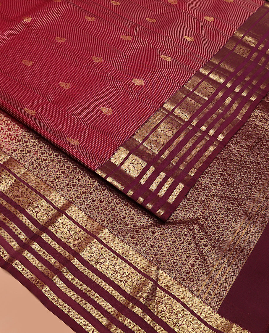 Apple red zari buttas and striped Vasundhara silk mix saree, contrast border of thilakam mokku, banaras, kathir, and kodi visiry designs, and jaal pallu