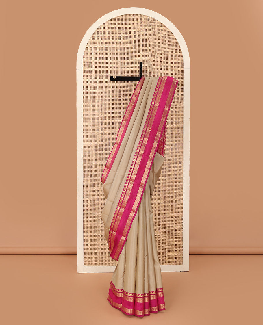 Sandal plain Kanchipuram silk saree, contrast rettai pettu border of thazampoo rekku, neli, chakram, and kuthirai, and jaal pallu