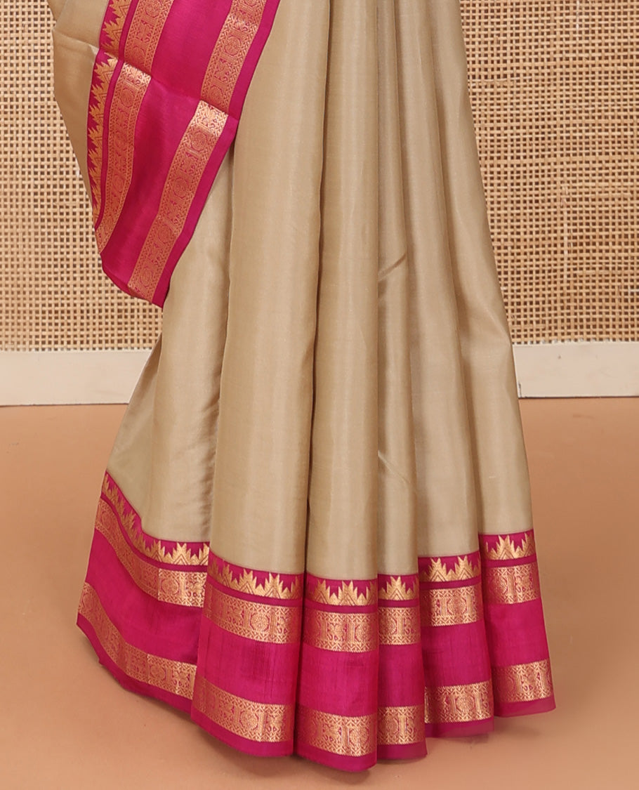 Sandal plain Kanchipuram silk saree, contrast rettai pettu border of thazampoo rekku, neli, chakram, and kuthirai, and jaal pallu