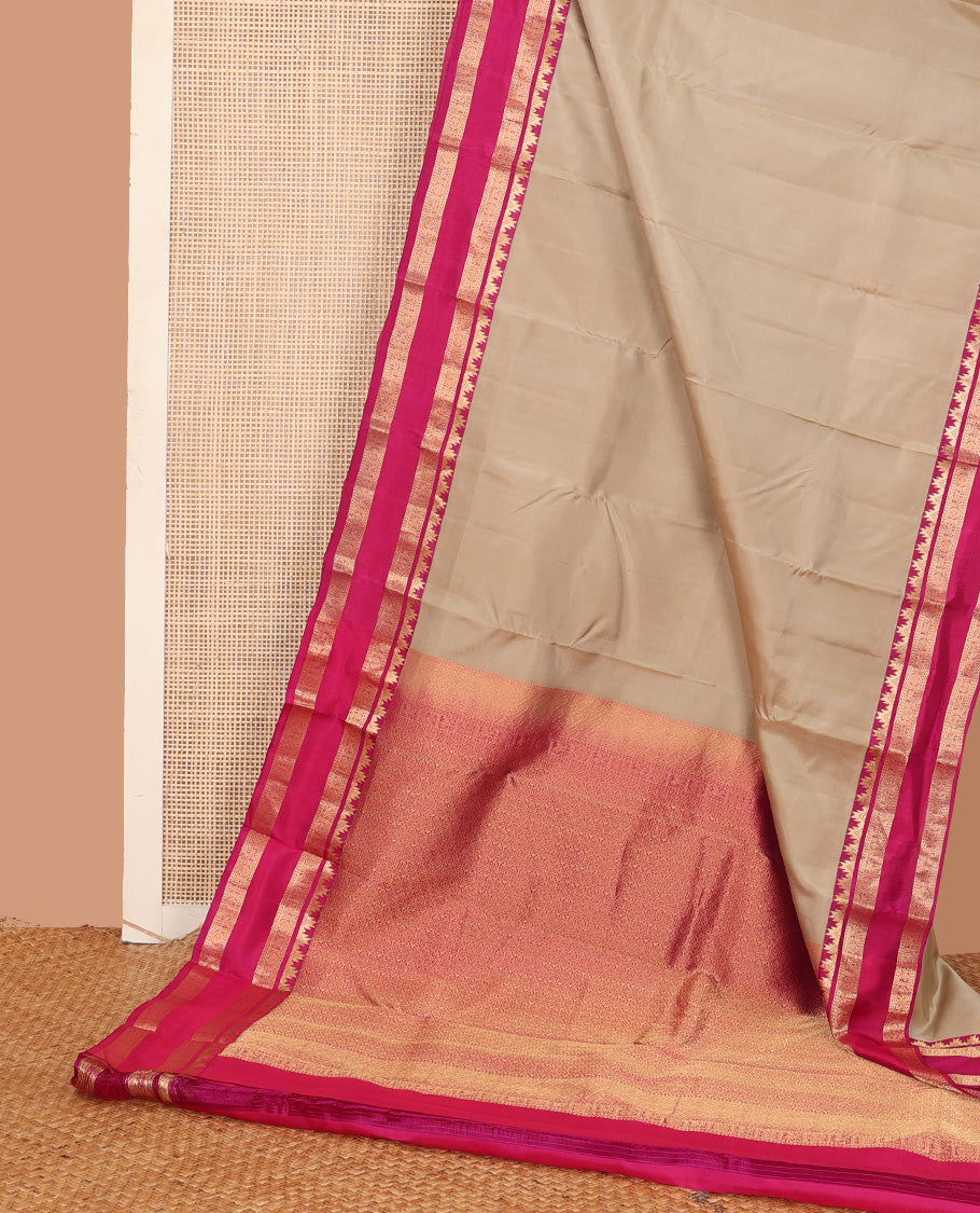Sandal plain Kanchipuram silk saree, contrast rettai pettu border of thazampoo rekku, neli, chakram, and kuthirai, and jaal pallu