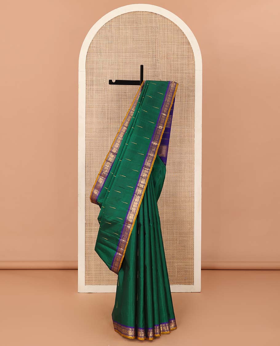 Green malli mokku buttas Kanchipuram silk saree, contrast border of rekku, muthu, banaras, and mayil designs, and traditional design pallu