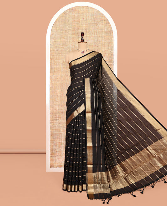 Black Assam Silk Saree, Subtly Enriched with Zari Stripes, Highlighted by a Zari Traditional Border, Zari-Striped Pallu, and a Matching Blouse
