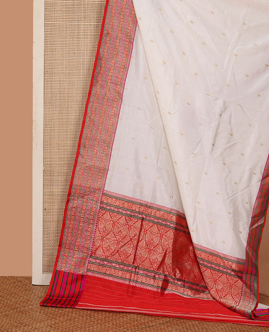 Cream zari buttas katan silk saree, contrast floral creeper design steeped border, and floral design weave pallu