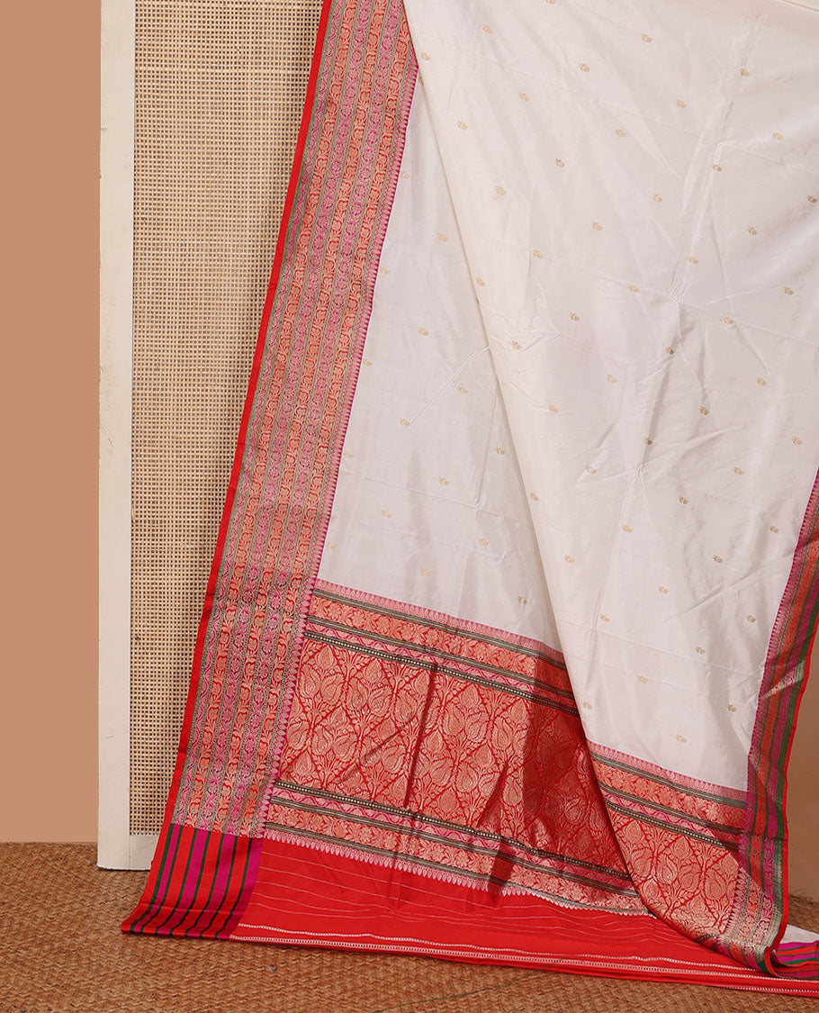 Cream zari buttas katan silk saree, contrast floral creeper design steeped border, and floral design weave pallu
