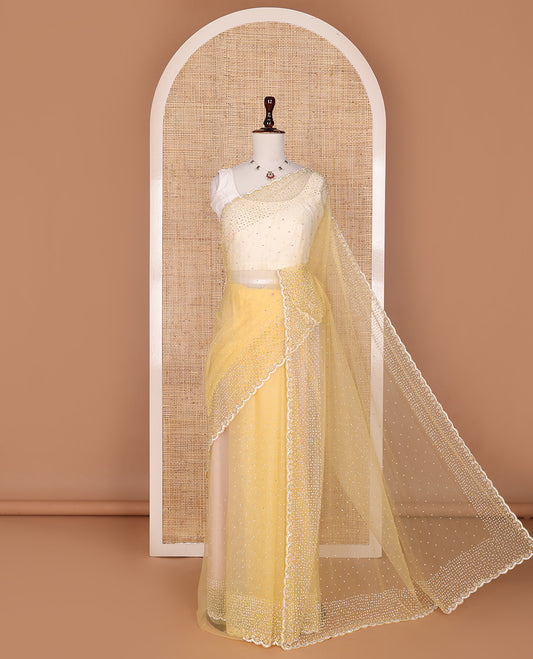 Pale yellow crystal stone & pearl beads embroidered designer saree with scallop embroidered border