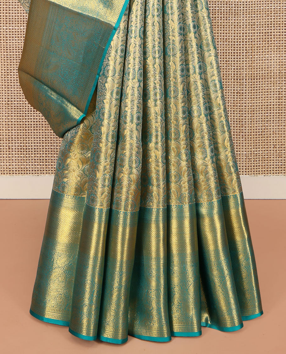 Blue Kanchipuram Silk Saree, Elegantly Highlighted with Zari Jacquard Design All Over Its Body, Highlighted by a Zari Border of Thilakam Mokku, Muthu, Mayil Kann, and Manga Designs, and Pallu of Mughal-Style Designs, and Paired with a Matching Blouse
