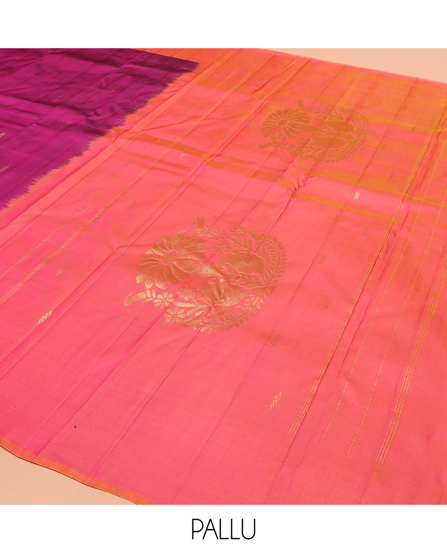 Purple Kanchipuram Silk Saree Featuring All-Over Zari Buttas, Highlighted by a Contrast Border with Leaf Zari Buttas, and a Pallu Adorned with Floral Motifs, Paired with a Subtle Contrast Plain Blouse