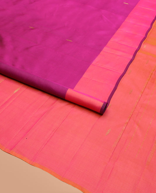 Purple Kanchipuram Silk Saree Featuring All-Over Zari Buttas, Highlighted by a Contrast Border with Leaf Zari Buttas, and a Pallu Adorned with Floral Motifs, Paired with a Subtle Contrast Plain Blouse
