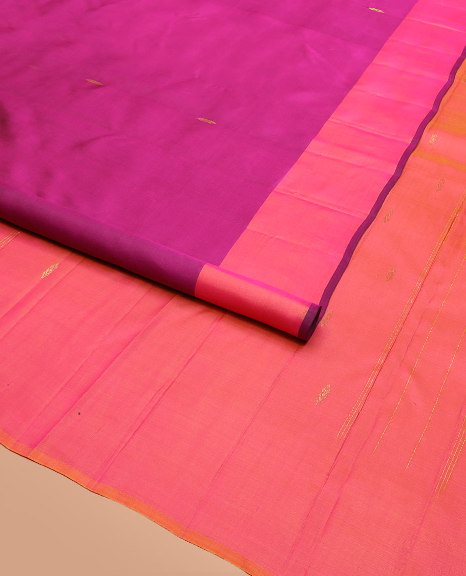 Purple Kanchipuram Silk Saree Featuring All-Over Zari Buttas, Highlighted by a Contrast Border with Leaf Zari Buttas, and a Pallu Adorned with Floral Motifs, Paired with a Subtle Contrast Plain Blouse