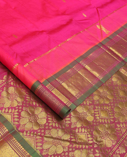 Pink Kanchipuram Silk Saree, Woven with Zari Buttas All Over Its Body, Complemented by Contrast One-Sided Border of Panner Sombu, Banaras, Muthu and Jaal Designs, Pallu Features Floral-Diamond Designs, and Comes Without a Blouse