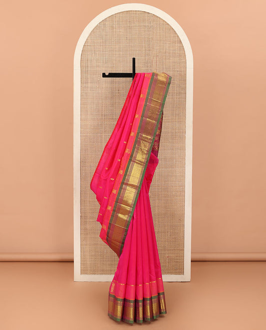 Pink Kanchipuram Silk Saree, Woven with Zari Buttas All Over Its Body, Complemented by Contrast One-Sided Border of Panner Sombu, Banaras, Muthu and Jaal Designs, Pallu Features Floral-Diamond Designs, and Comes Without a Blouse