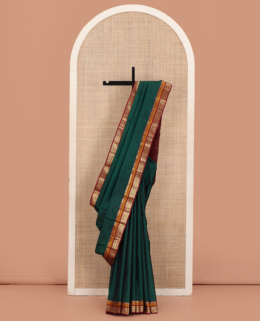 Green Plain Kanchipuram Silk Saree, Complemented by a Contrast Border of Rekku, Muthu, Rettai Neli, and Rudraksham Designs, Zari-Woven Pallu, and Paired with a Contrast Blouse