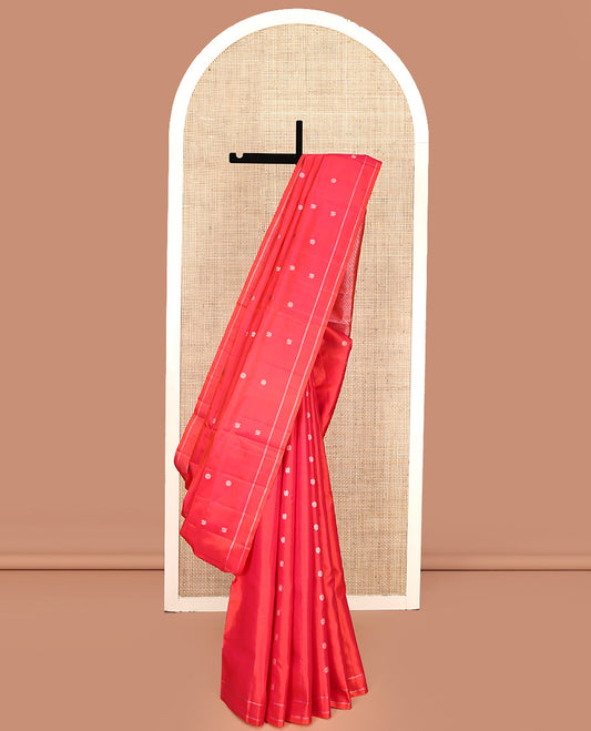 Coral Pink Mayuri Soft Silk Saree, Artfully Woven with Mayil and Chakram Buttas All Over Its Body, Subtle Zari Border, Grand Pallu and Paired with a Matching Blouse