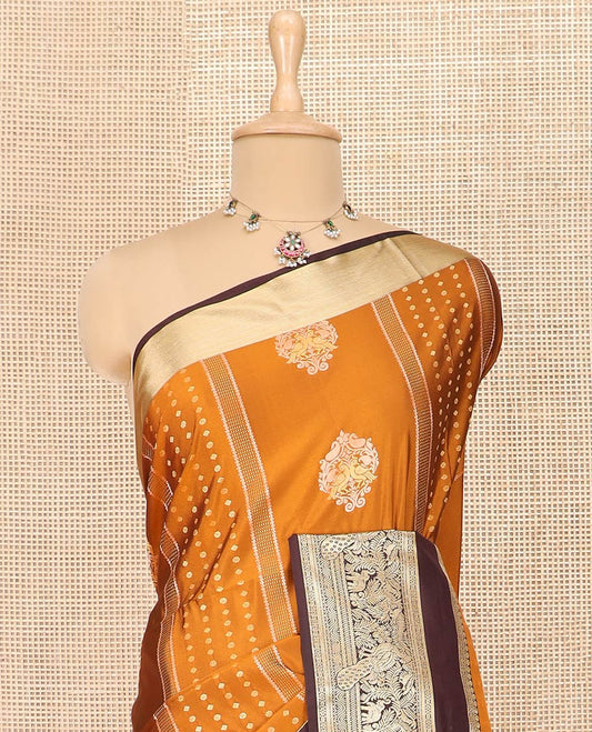 Orange Semi-Soft Silk Saree Elevated with Intricate Designs Woven All Over Its Body, Complemented by Contrast Traditional Zari Design Rettai Pettu Border, Opulently Embellished Pallu of Intricate Zari Designs, and Paired with a Contrast Blouse