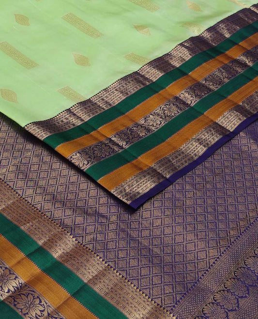 Green zari buttas silk saree, contrast border of rekku, neli, lavangam, Muthu, and rudraksham designs, and jaal pallu