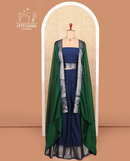 Blue plain cotton half-saree with traditional bordered skirt, matching blouse, and a contrast traditional bordered dhavani
