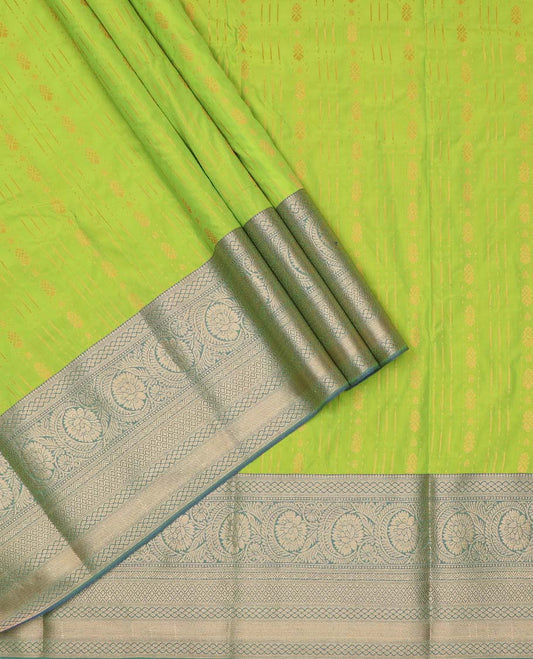 Parrot green art silk pavadai material, zari design with contrast traditional zari border skirt, and contrast blouse
