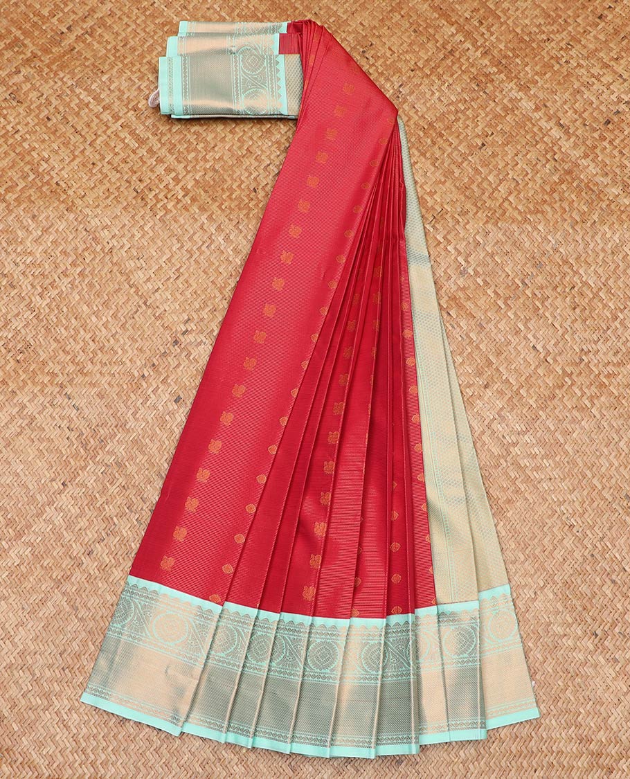 Red peacock chakram buttas and striped gift saree, contrast traditional zari border, and intricate pallu