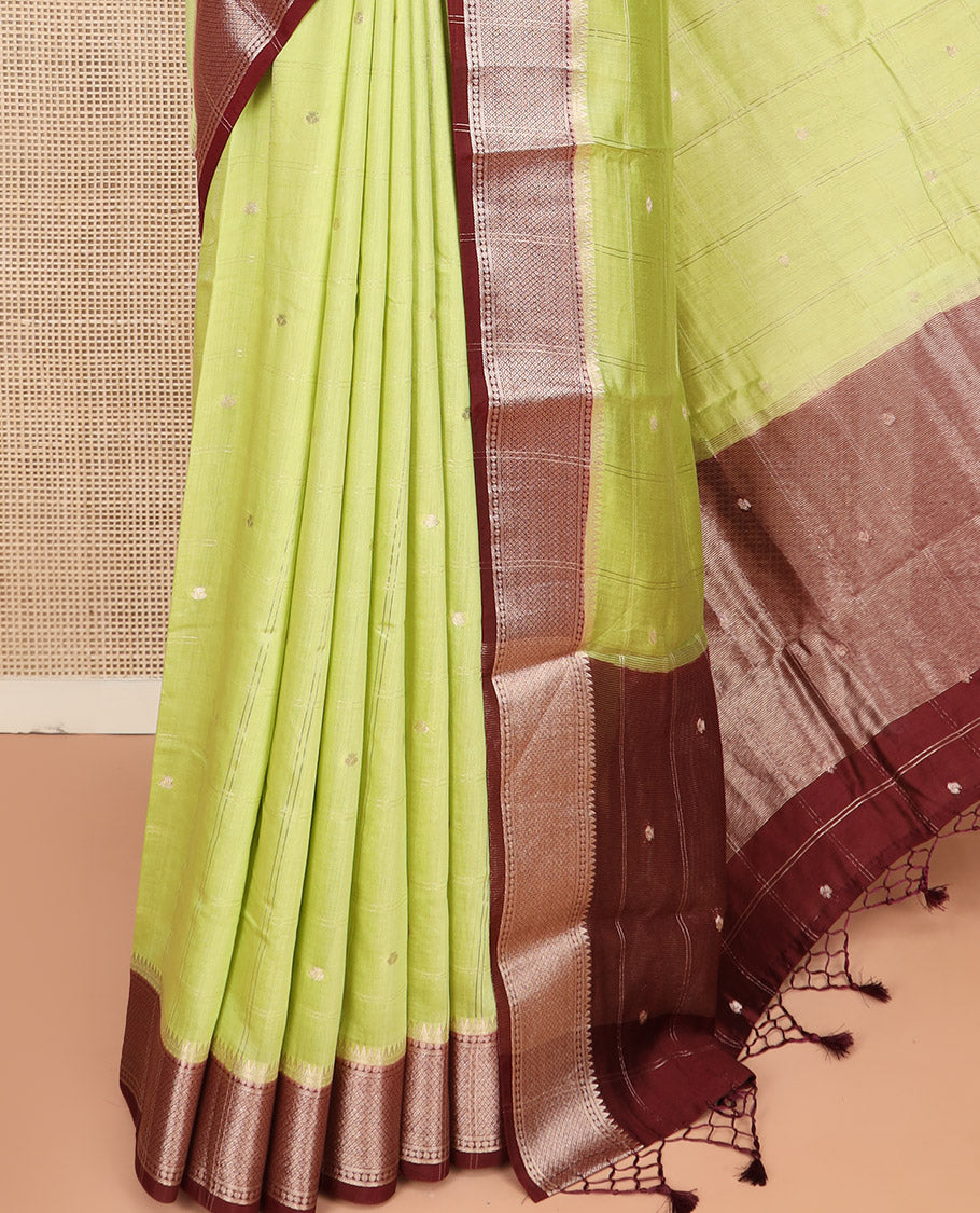Green Assam Silk Saree Sparsely Sparkled with Zari Butta Enclosed Checks on Its Body, Complemented by a Contrast Traditional Zari Design Woven Border, Scintillating Pallu, and Paired with a Contrast Blouse
