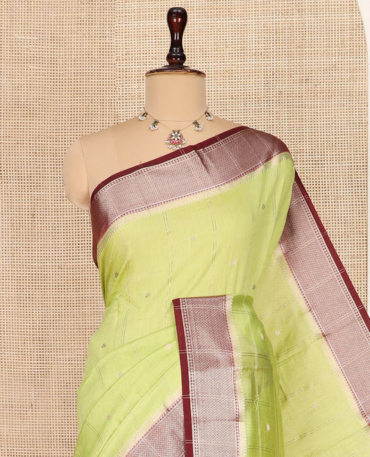 Green Assam Silk Saree Sparsely Sparkled with Zari Butta Enclosed Checks on Its Body, Complemented by a Contrast Traditional Zari Design Woven Border, Scintillating Pallu, and Paired with a Contrast Blouse