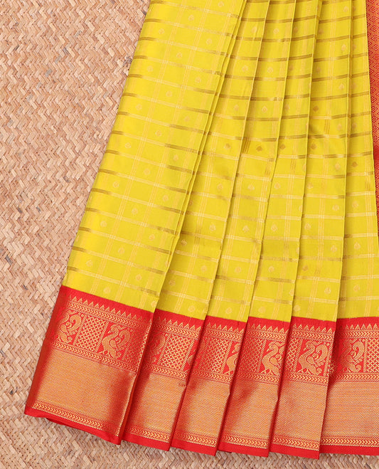 Yellow Budget Silk Saree, Subtly Sparkled With Zari Buttas and Stripes All Over Its Body, Complemented by Contrast Traditional Zari Designs Woven Border, Grand Jaal Pallu and Paired with a Contrast Blouse