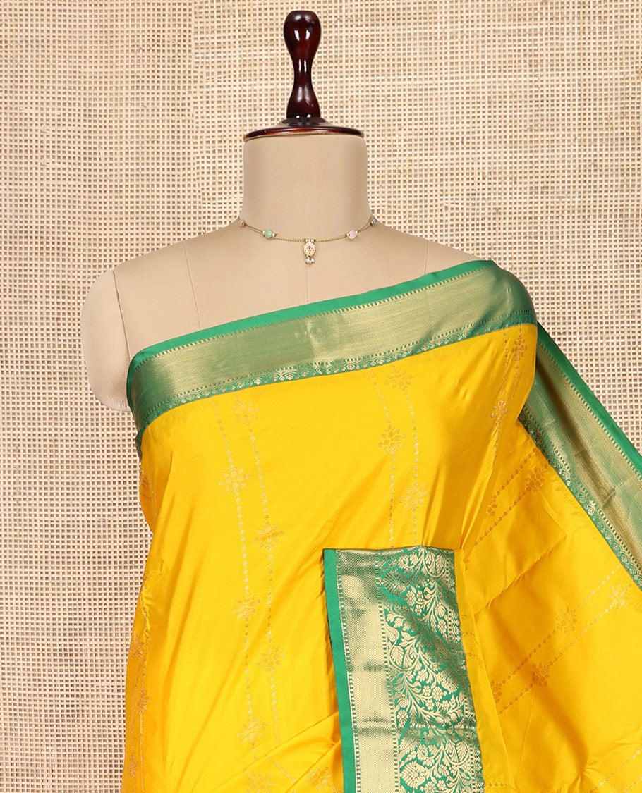 Yellow Budget Silk Saree, Subtly Sparkled with Zari Buttas, Complemented by a Contrast Traditional Border, Pallu of Intricate Designs, and a Contrast Blouse