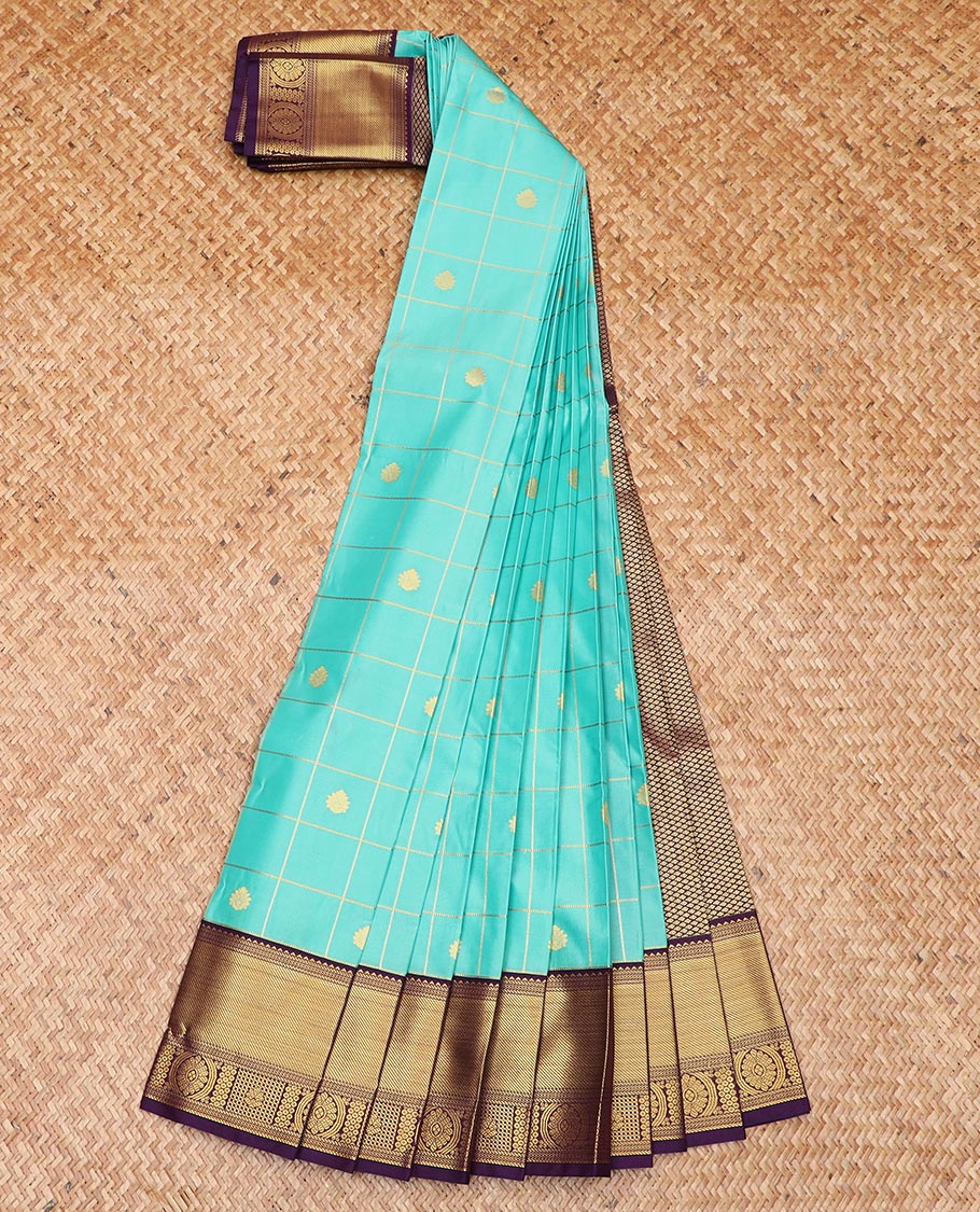 Turquoise Budget Silk Saree Enthralled with Zari Buttas Enclosed Checks, Complemented by a Contrast Traditional Design Border, Vibrant Jaal Design Pallu, and a Contrast Blouse