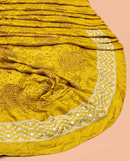 Yellow bandhani dotted bandhani silk saree, thread and mirror work border, and pallu of thread and mirror work