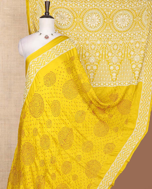 Yellow bandhani dotted bandhani silk saree, thread and mirror work border, and pallu of thread and mirror work