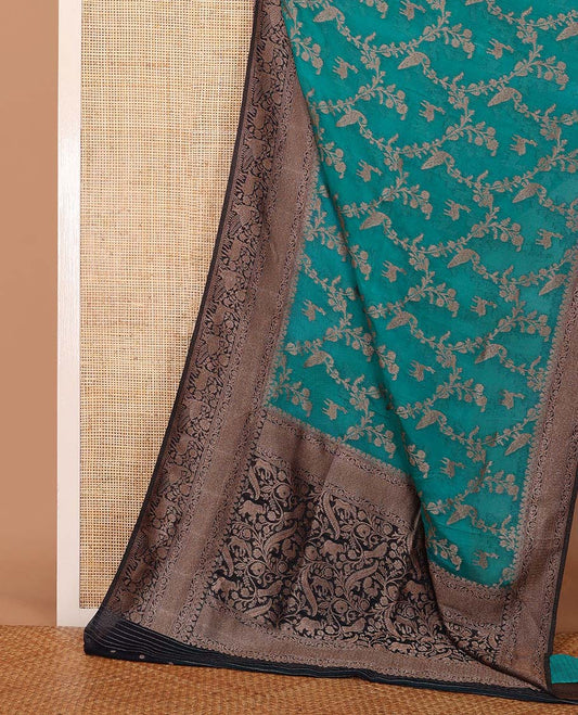 Blue floral jaal jacquard fancy crepe saree, contrast traditional zari border & flora-fauna motifs steeped pallu