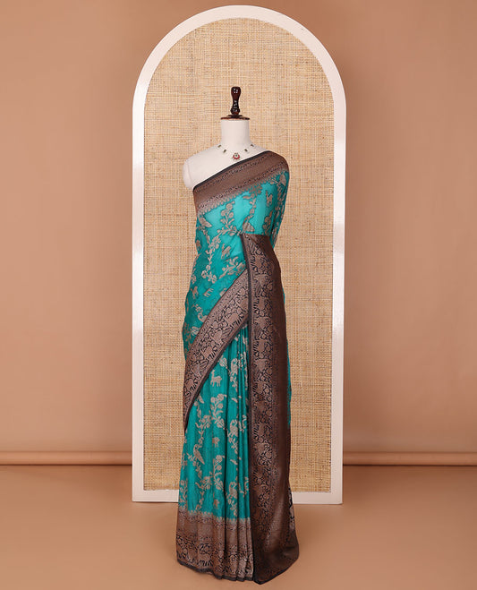 Blue floral jaal jacquard fancy crepe saree, contrast traditional zari border & flora-fauna motifs steeped pallu