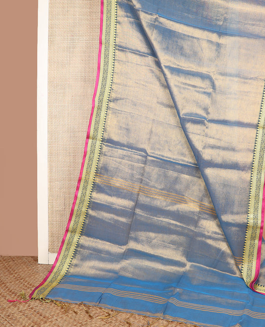 Blue gleaming plain saree, contrast traditional motifs thread woven border, and striped pallu