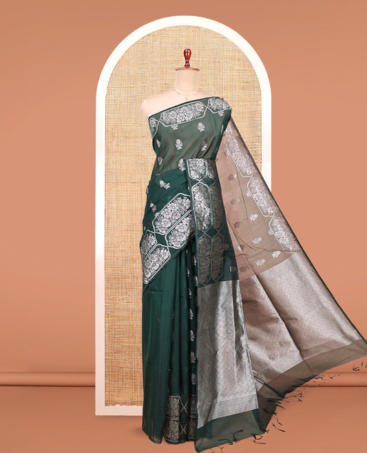 Green Semi-Silk Cotton Saree, Decked Up with Zari Buttas All Over Its Body, Highlighted by a Zari Border of Floral Designs, Gleaming Jaal Pallu, and Paired with a Matching Blouse