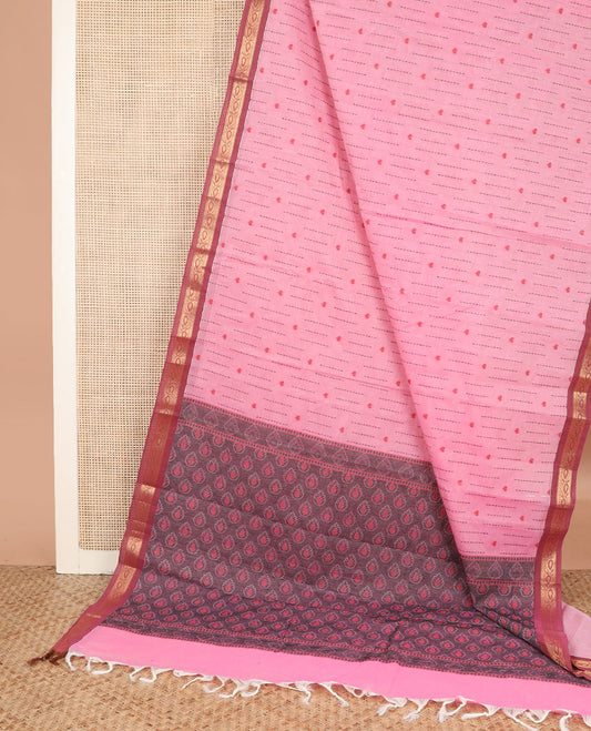 Pink dotted stripes, and heart buttas kanchi cotton saree, contrast zari border, and thilaka motifs steeped pallu