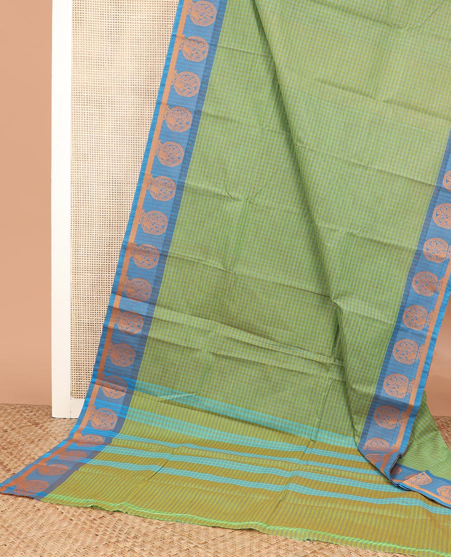 Green checked Chettinad cotton saree, contrast round buttas border, and zari striped pallu