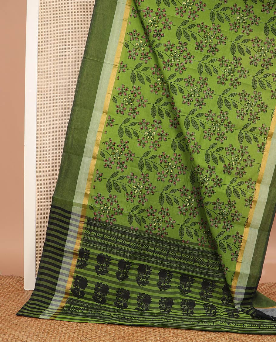Green floral and leaf printed chirala cotton saree, contrast zari border, and pallu of floral print