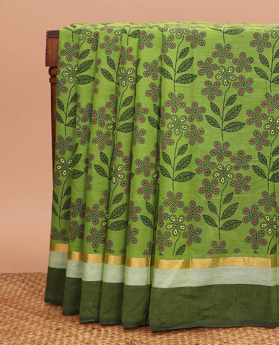 Green floral and leaf printed chirala cotton saree, contrast zari border, and pallu of floral print