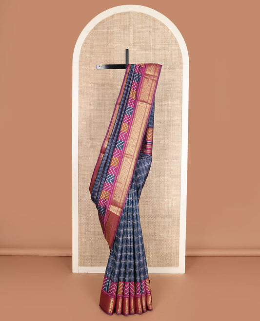 Blue geometric patterned semi-banaras patola silk saree, contrast chevron border of traditional zari designs, and pallu of geometric motifs
