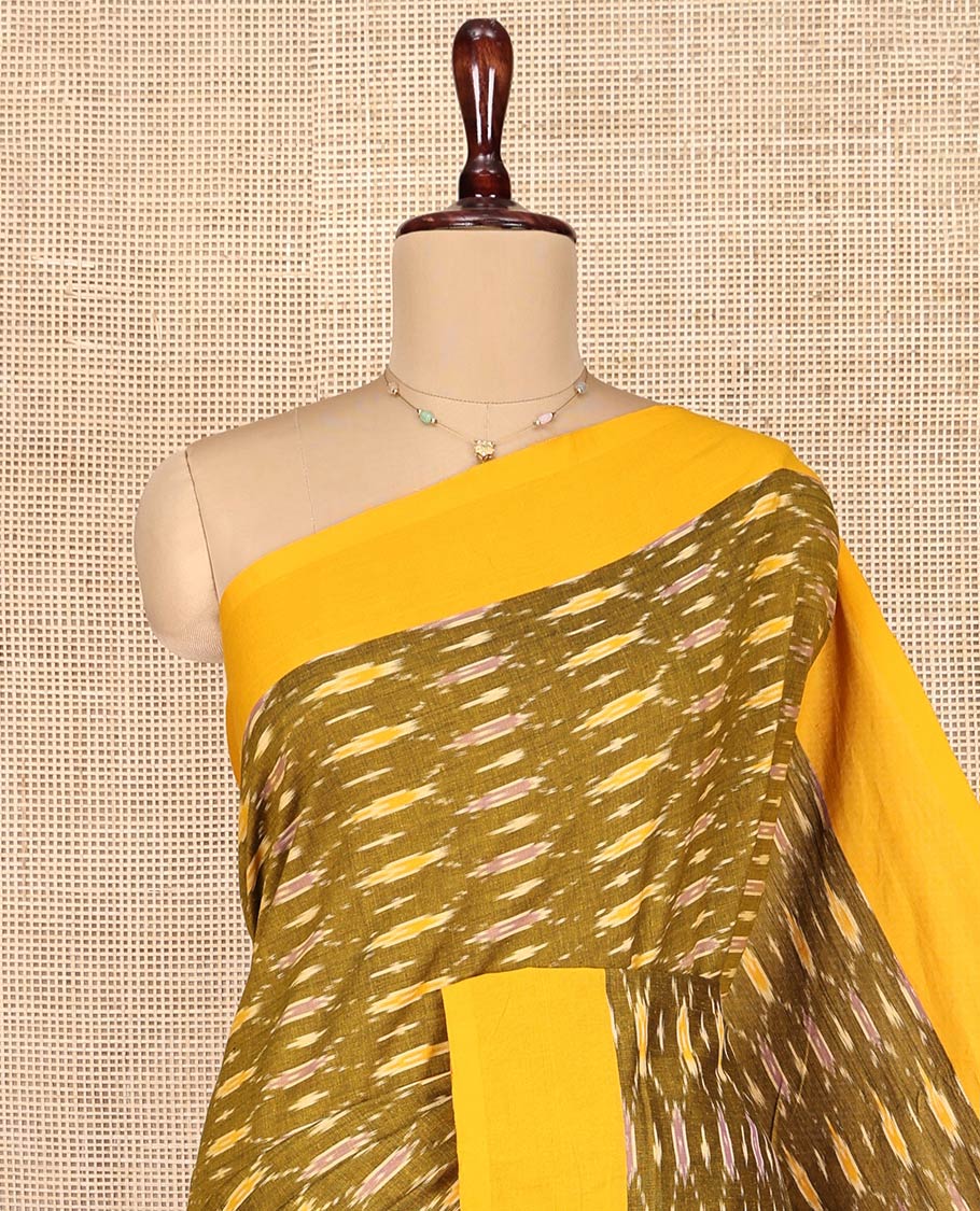 Green Ikkat Cotton Saree, Adorned with Ikkat-Style Ogee Patterns on Its Body, Complemented by Contrast Plain Border, Pallu of Ikkat Designs, and Has No Blouse
